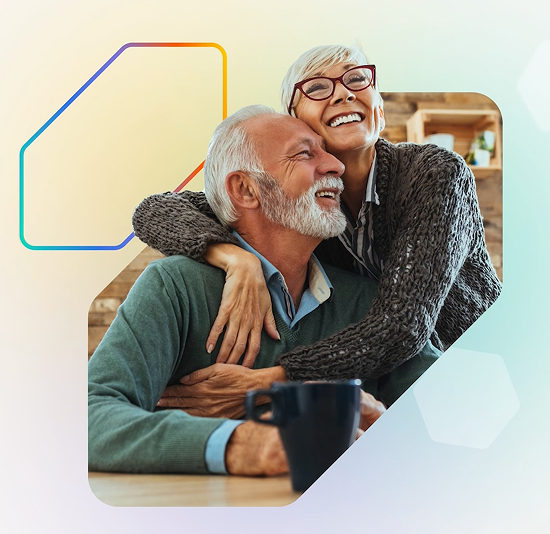 A senior man and woman embrace